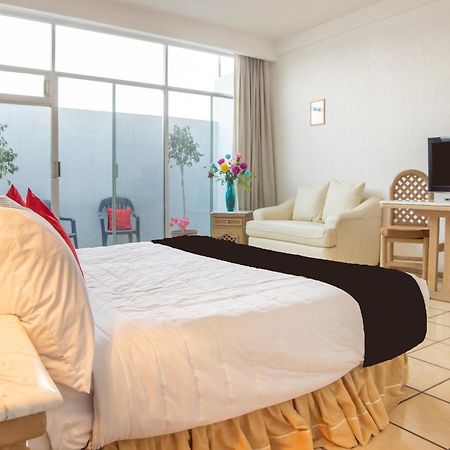 Capital O Hotel Villa Monini Puebla Bagian luar foto