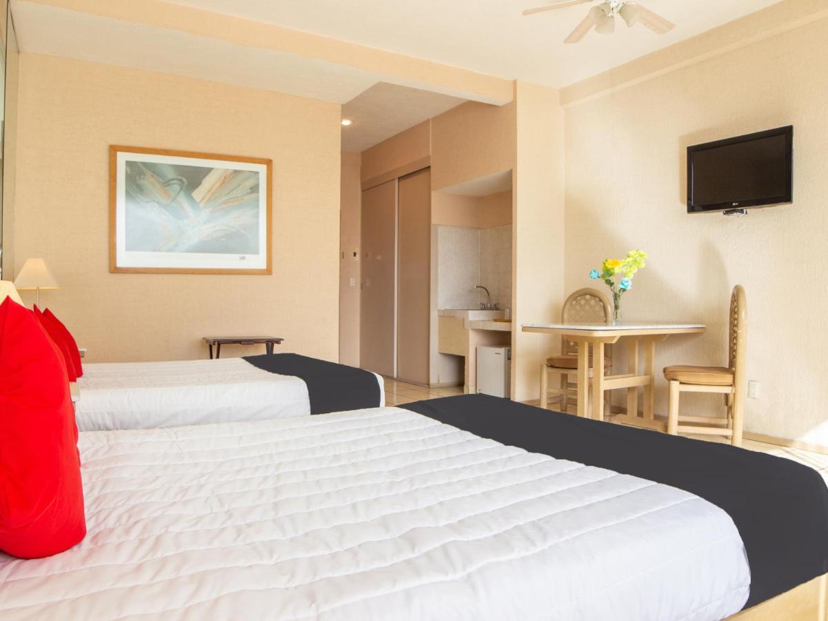 Capital O Hotel Villa Monini Puebla Bagian luar foto
