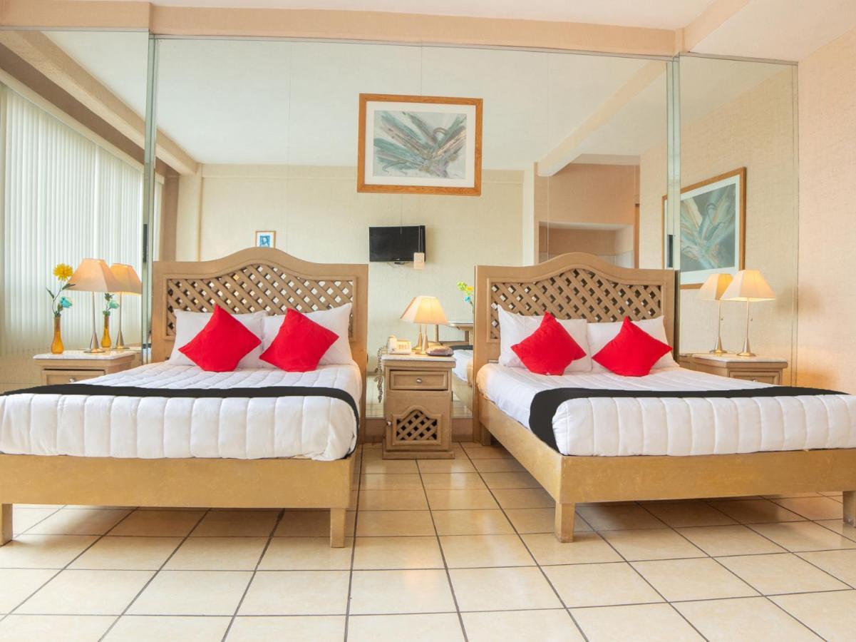 Capital O Hotel Villa Monini Puebla Bagian luar foto